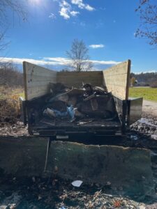 Junk removal truck bed filled with random debris