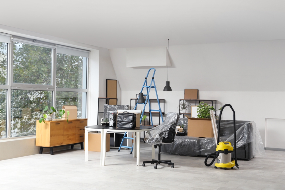 A home's office supplies before a cleanout with all of the furniture stacked neatly and packed nicely