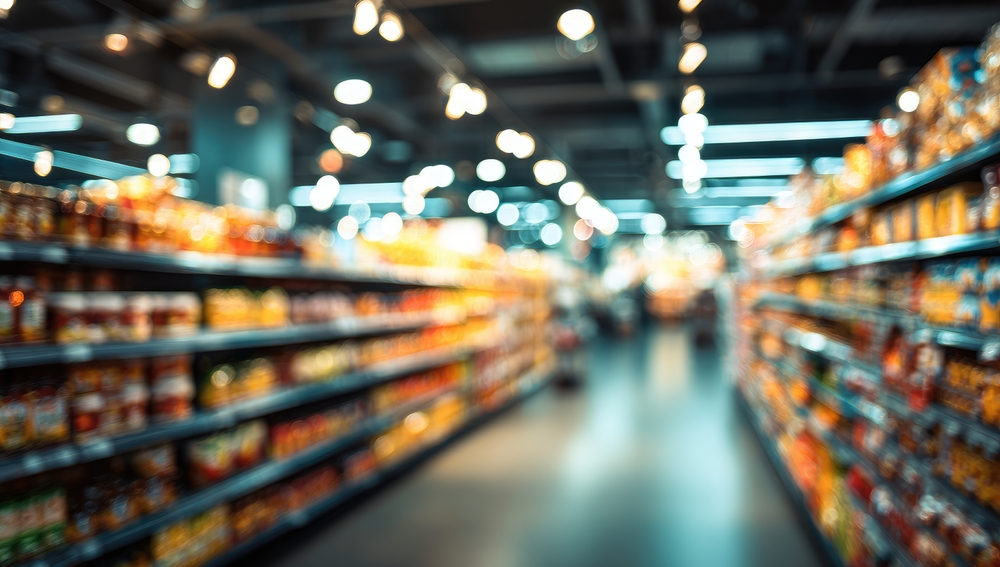 Blurred view of shelves stocked with products in a retail store